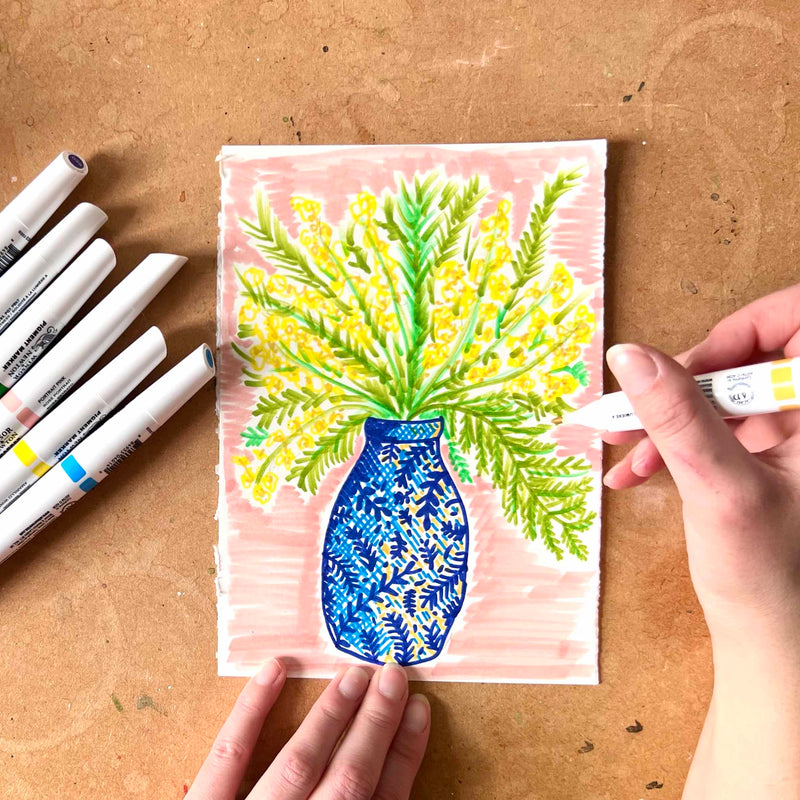 100 Day project - 100 doodles. Day one - a colourful quick pen sketch of a mimosa bunch in a blue patterned vase, with a pink background.